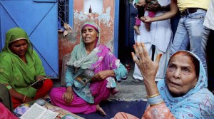 Relatives mourn the death of farmer Mohammad Akhlaq at his home in Bisara village on Wednesday. Villagers allegedly beat Akhlaq to death and severely injured his son upon hearing rumors that the family was eating beef. (Source: PTI Photo)